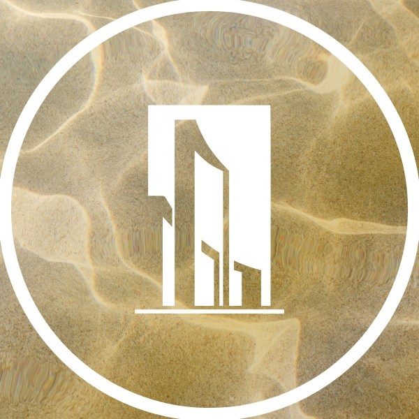 White building icon on sandy background with circular border.